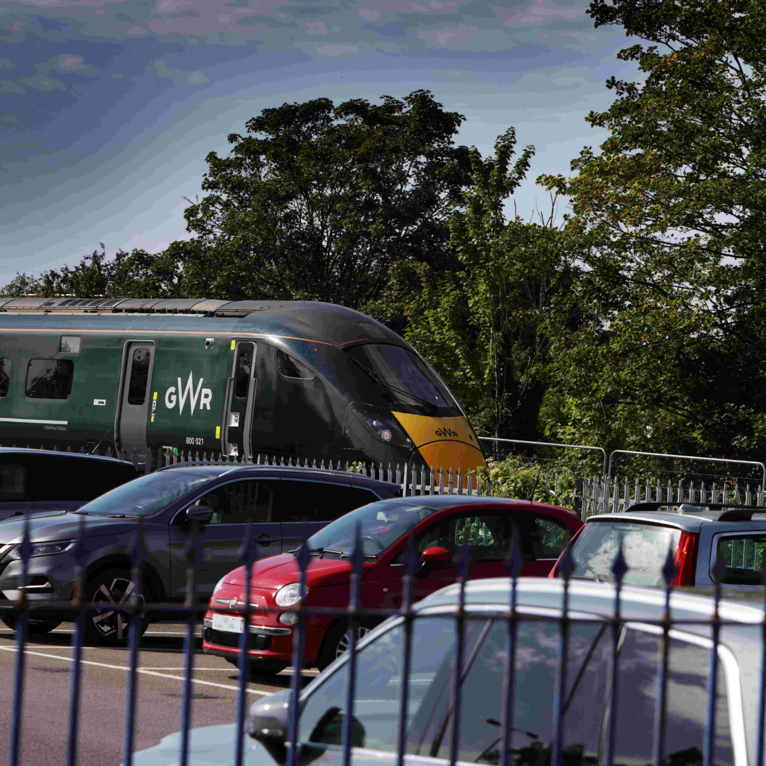 a train pulling into Oxford Station behind the car park